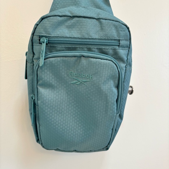 Reebok Cosmos Crossbody Bag Sling Backpack - Picture 2 of 14